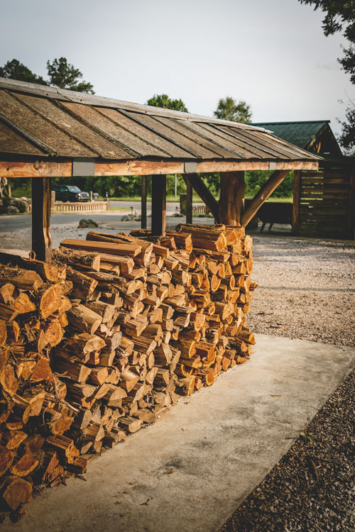 photo shows bulk firewood racks available for sale at Rustic Roots Warehouse
